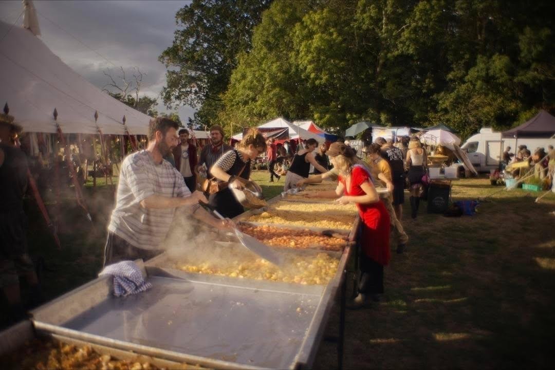 Volunteers peeling and chopping apples for the world's biggest apple crumble at Ferally Good Festival