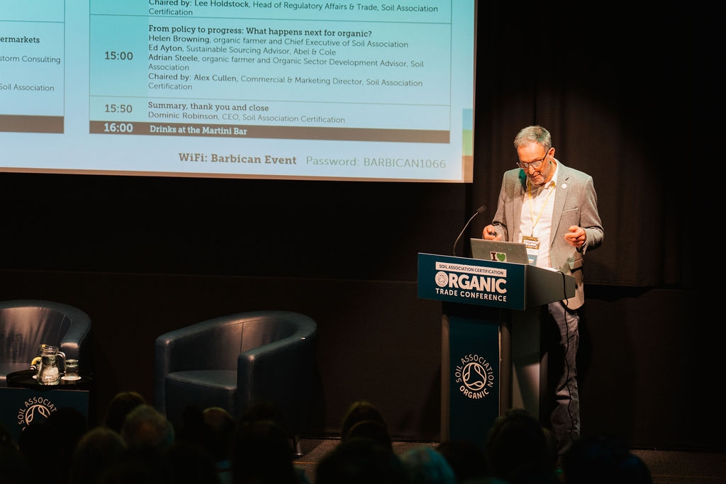 Speaker at the podium at the Soil Association Organic Trade Conference at the Barbican, London